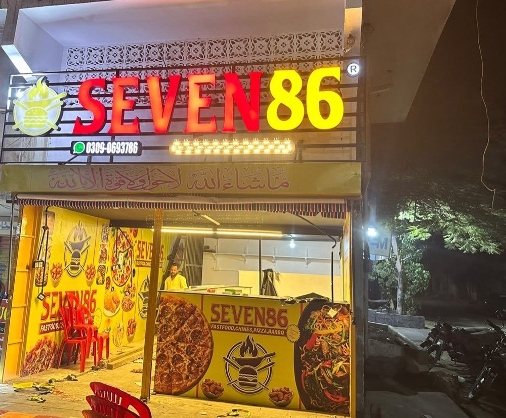 The Seven86 shop front at night in FB Area Block 7, Karachi